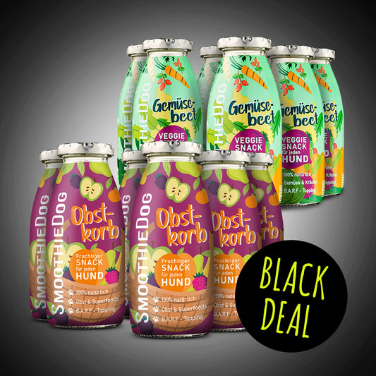 Abgebildet ist der SmoothieDog Black Deal des Tages mit den Sorten Gemüsebeet und Obstkorb als 12er-Pack. Die grünen und violetten Flaschen stehen kompakt vor schwarzem Hintergrund, ergänzt durch einen schwarzen Kreis mit dem Schriftzug ‚Black Deal‘. Das Motiv betont die bunte Veggie-Auswahl des Angebots.