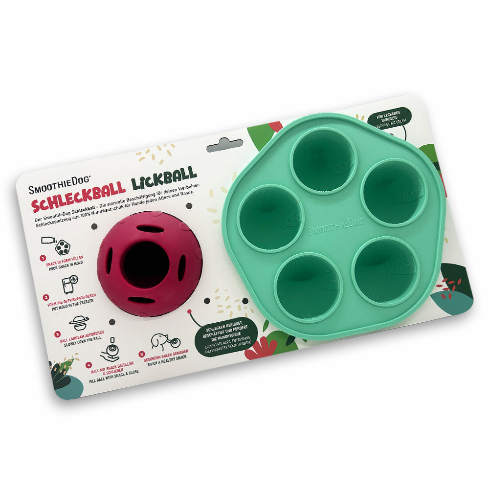SmoothieDog Schleckball-Set auf Blisterkarte: Das Produktset mit mintgrüner Eisform und rotem Schleckball ist auf einer bunt gestalteten Verpackungskarte zu sehen. Auf der Karte stehen Produktinformationen sowie Anwendungsbilder. Das Set eignet sich für Hunde aller Größen und Altersklassen.