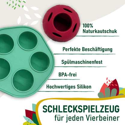 Produktvorteile des SmoothieDog Schleckballs im Überblick: Der rote Schleckball und die grüne Eisform sind dekorativ abgebildet. Daneben stehen Vorteile wie 100 % Naturkautschuk, perfekte Beschäftigung, spülmaschinenfest, BPA-frei und hochwertiges Silikon. Das Motiv richtet sich an Hundebesitzer, die Wert auf Qualität und Sicherheit legen.